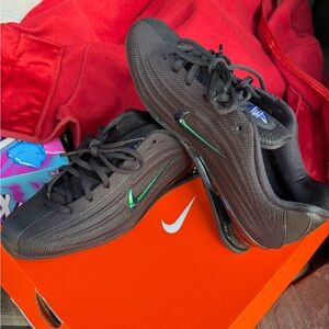 Nike Women's Shox Z SE shoes in a black colorway with green accents.